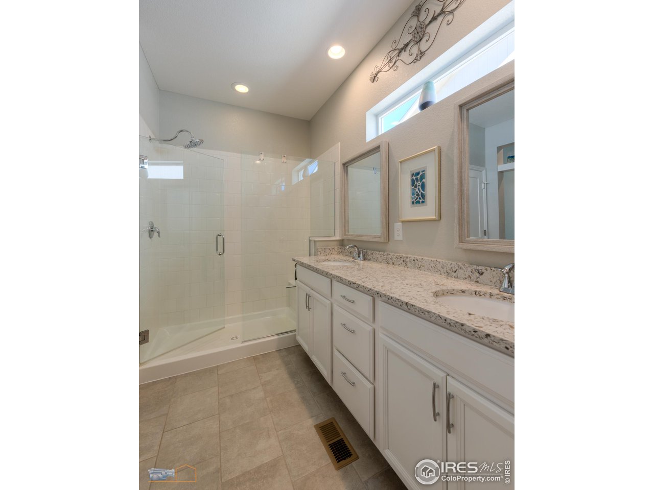 12908 Sandstone Drive Broomfield, CO 80021 - Photo 18 of 39 a spacious bathroom with a granite countertop sink a mirror and a shower