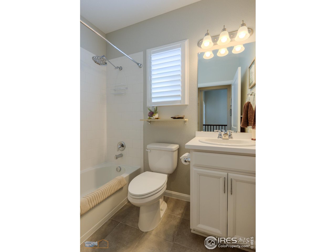 12908 Sandstone Drive Broomfield, CO 80021 - Photo 22 of 39 a bathroom with a toilet sink and mirror