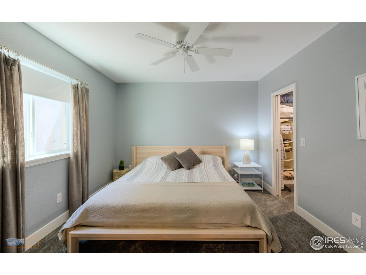 12908 Sandstone Drive Broomfield, CO 80021 - Photo 26 of 39 a bedroom with a bed and a window