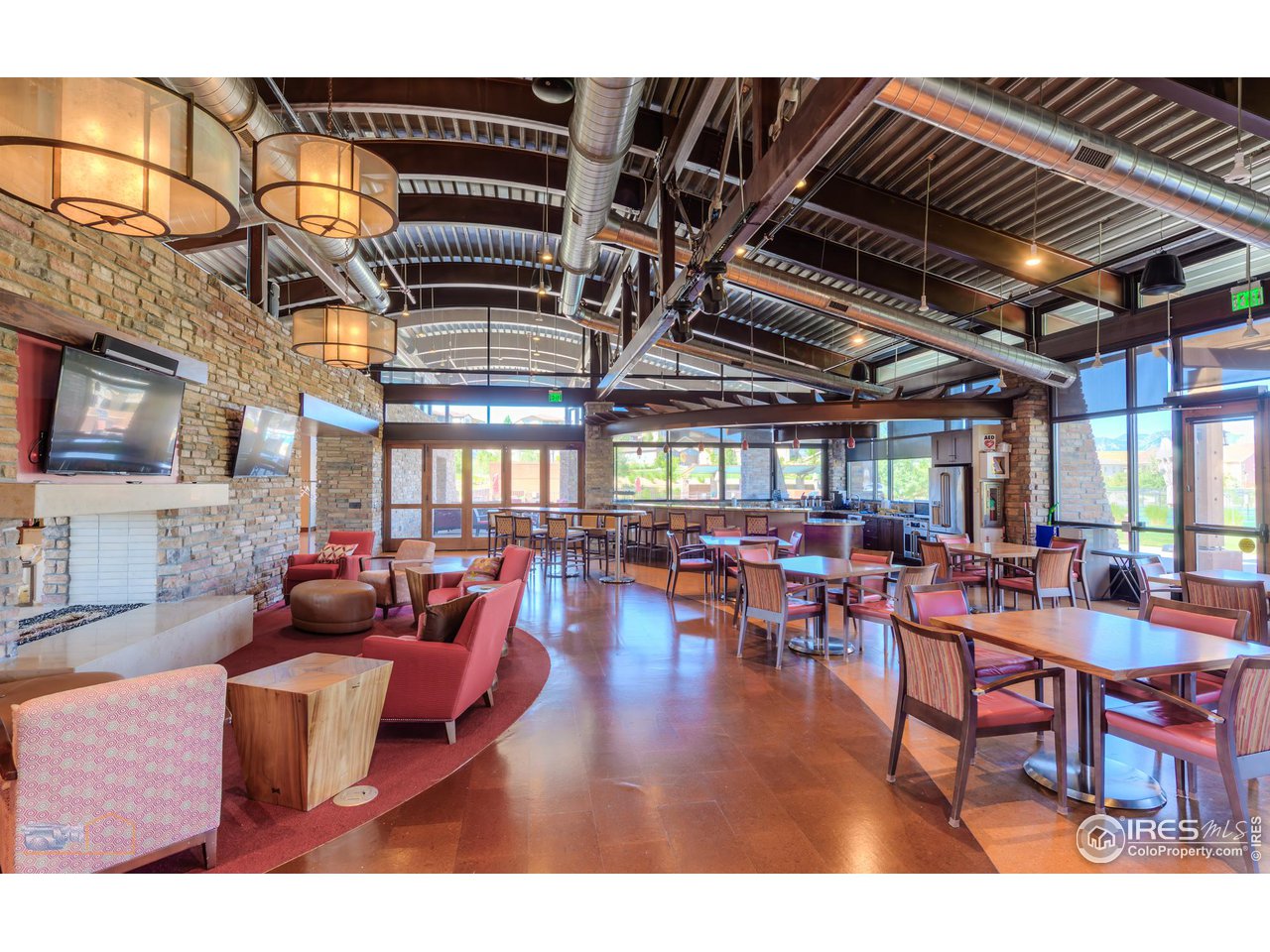 12908 Sandstone Drive Broomfield, CO 80021 - Photo 31 of 39 a living room with lots of furniture and a chandelier