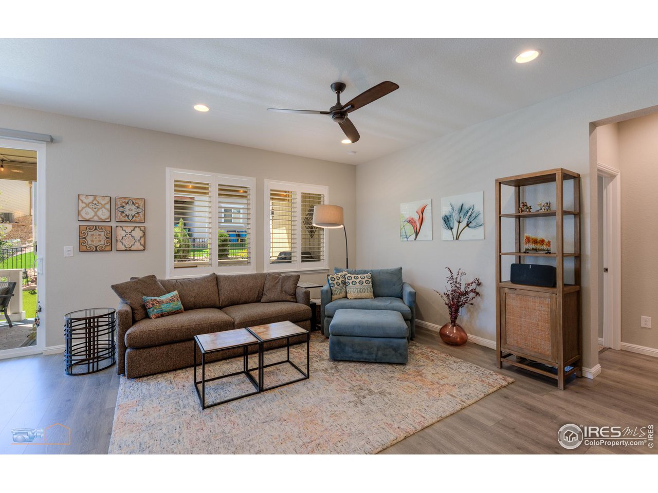 12908 Sandstone Drive Broomfield, CO 80021 - Photo 4 of 39 a living room with furniture and a window