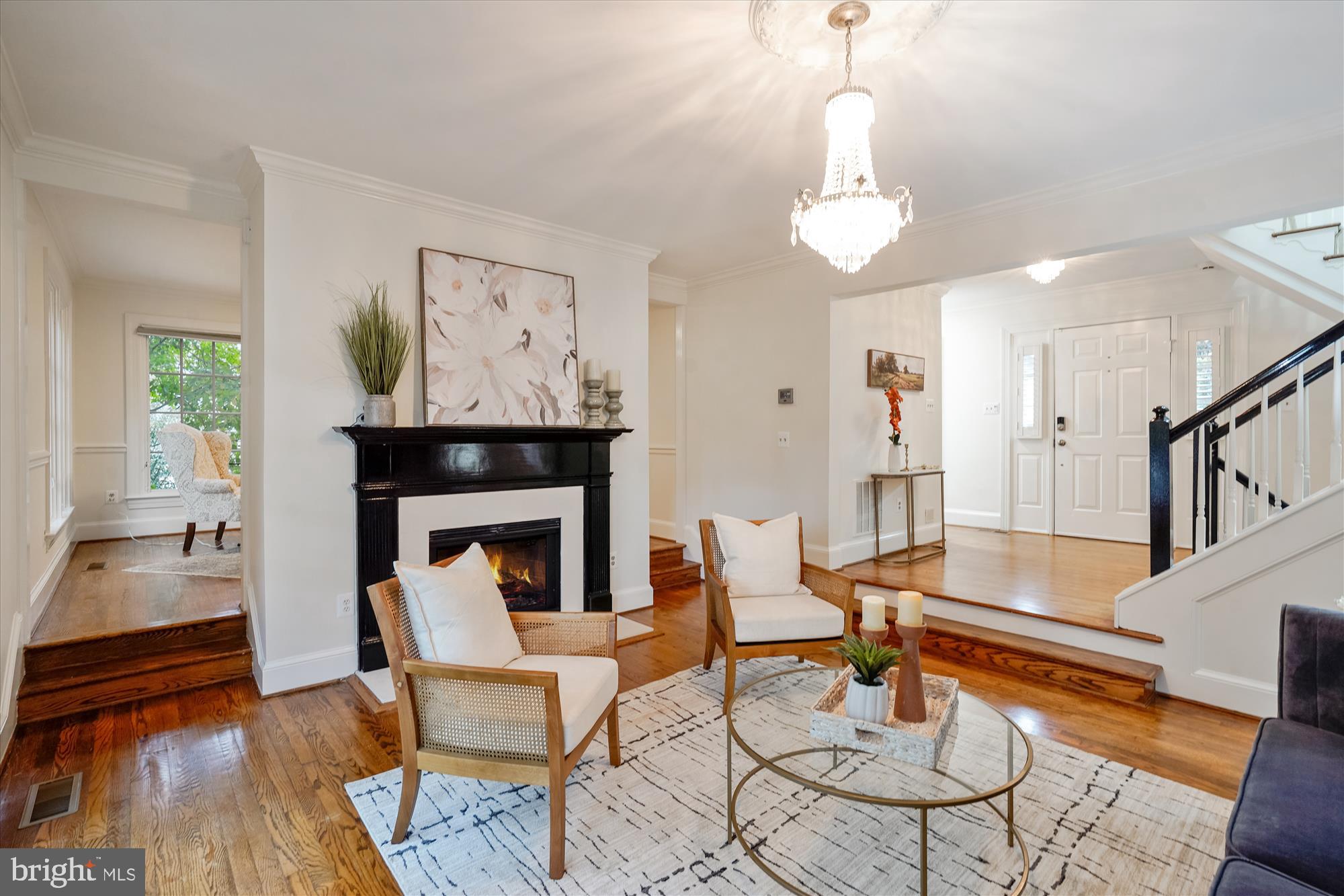 7252 Evans Mill Road McLean, VA 22101 - Photo 12 of 89 a living room with furniture a table and a fireplace