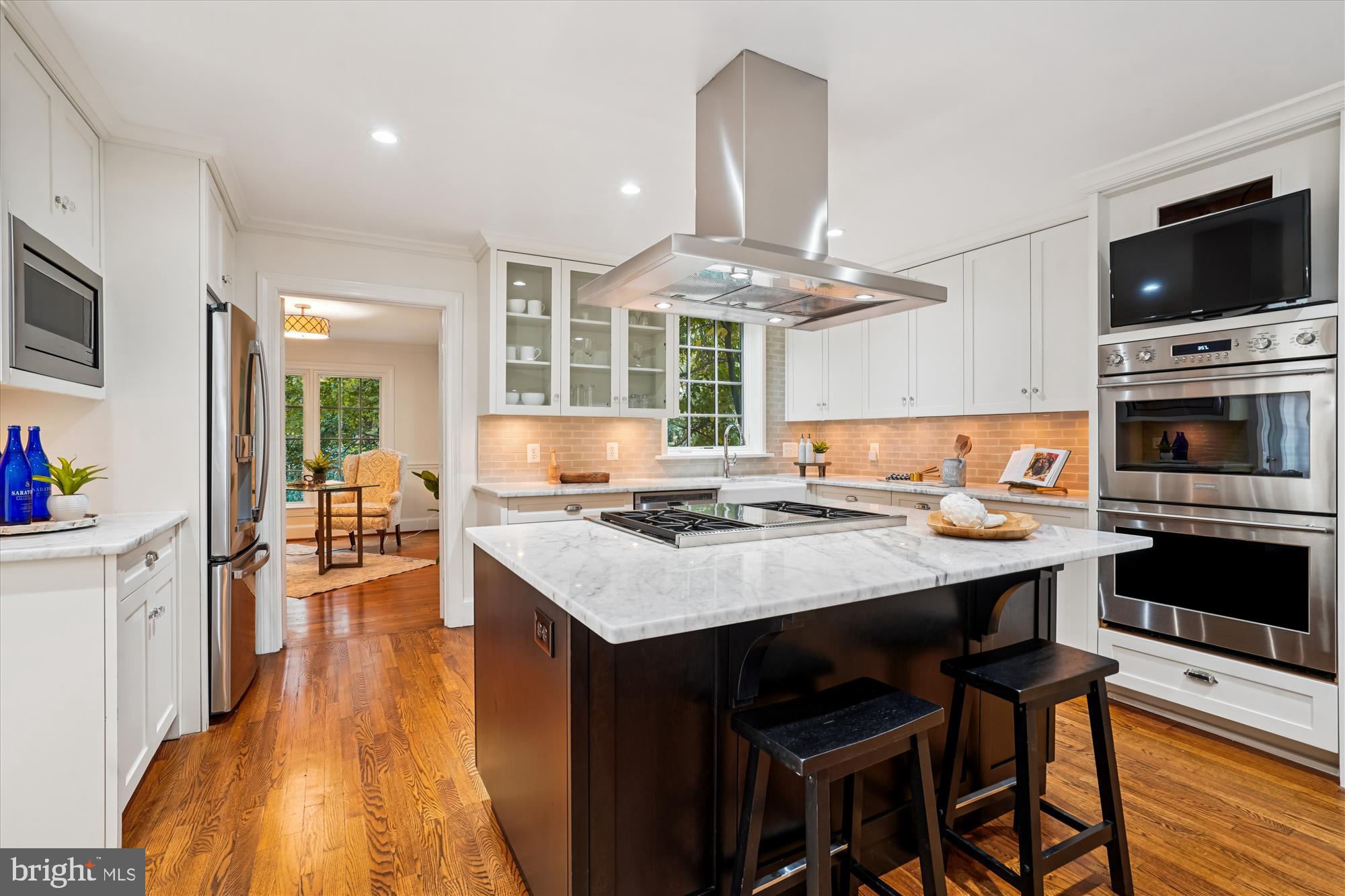 7252 Evans Mill Road McLean, VA 22101 - Photo 18 of 89 a open kitchen with a dining table and chairs