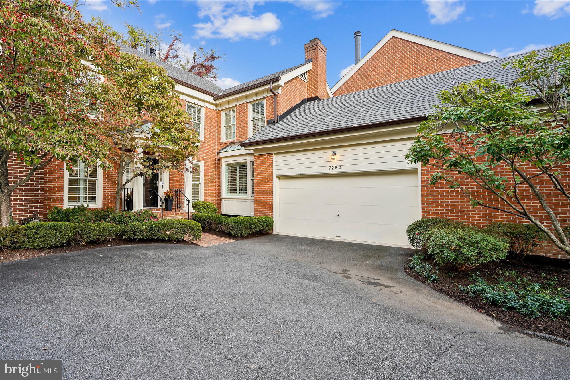 7252 Evans Mill Road McLean, VA 22101 - Photo 2 of 89 a front view of a house with garden
