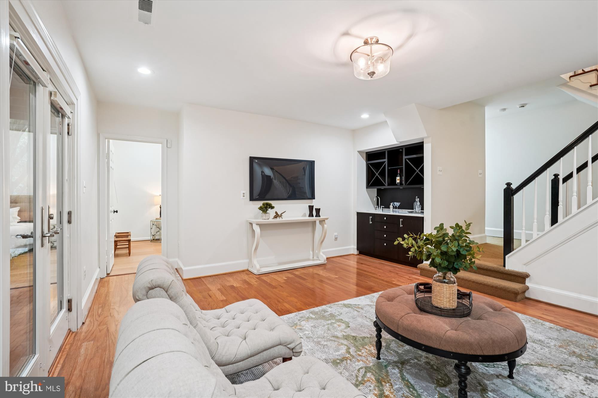 7252 Evans Mill Road McLean, VA 22101 - Photo 45 of 89 a living room with furniture and a flat screen tv