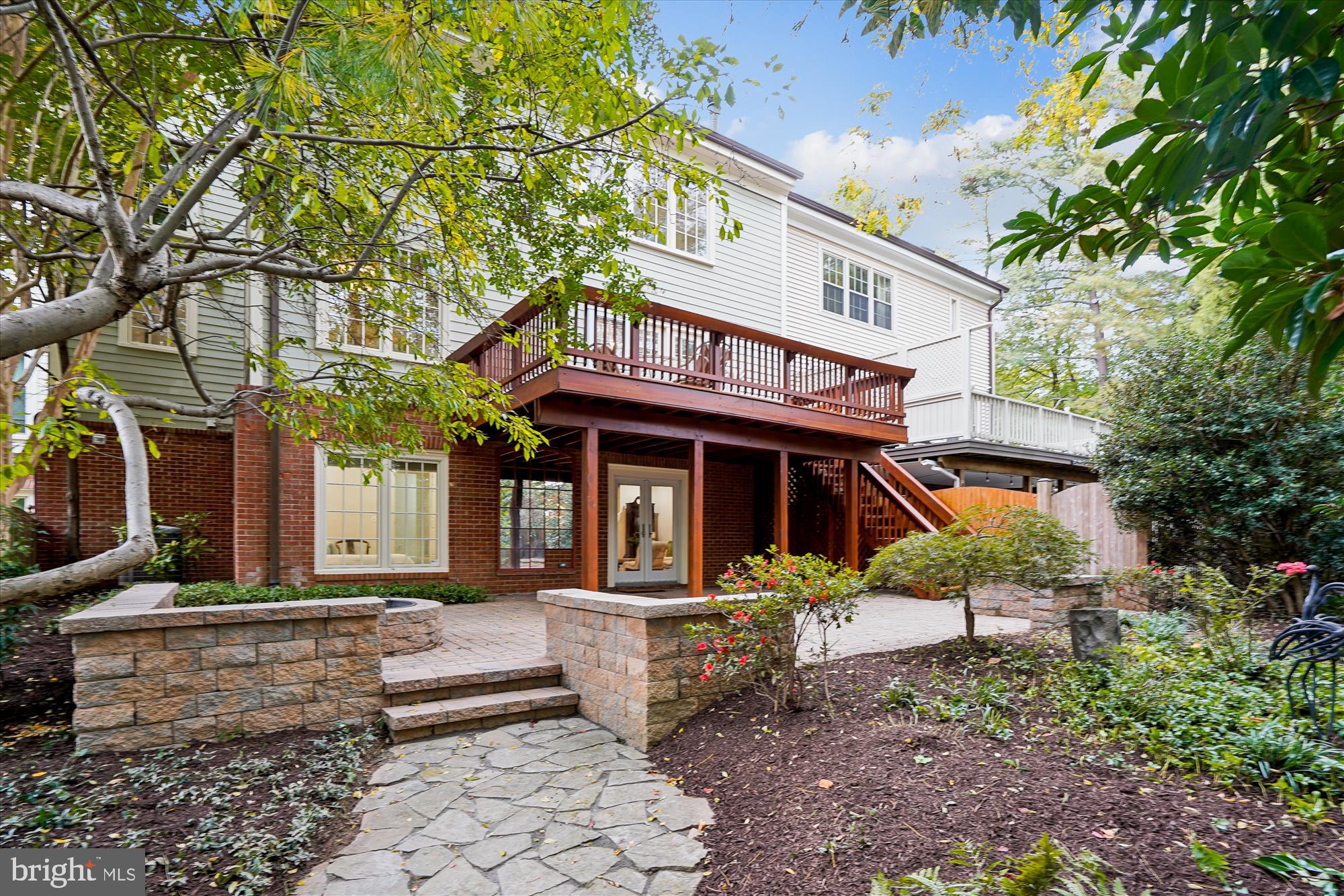 7252 Evans Mill Road McLean, VA 22101 - Photo 58 of 89 a front view of a house with a garden