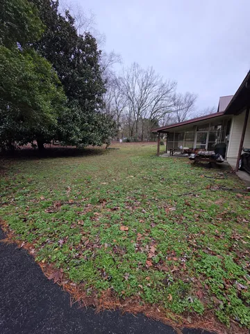 a backyard of a house with lots of green space