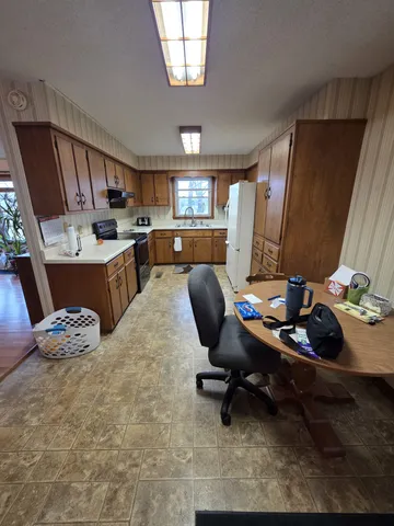 a view of a workspace with kitchen