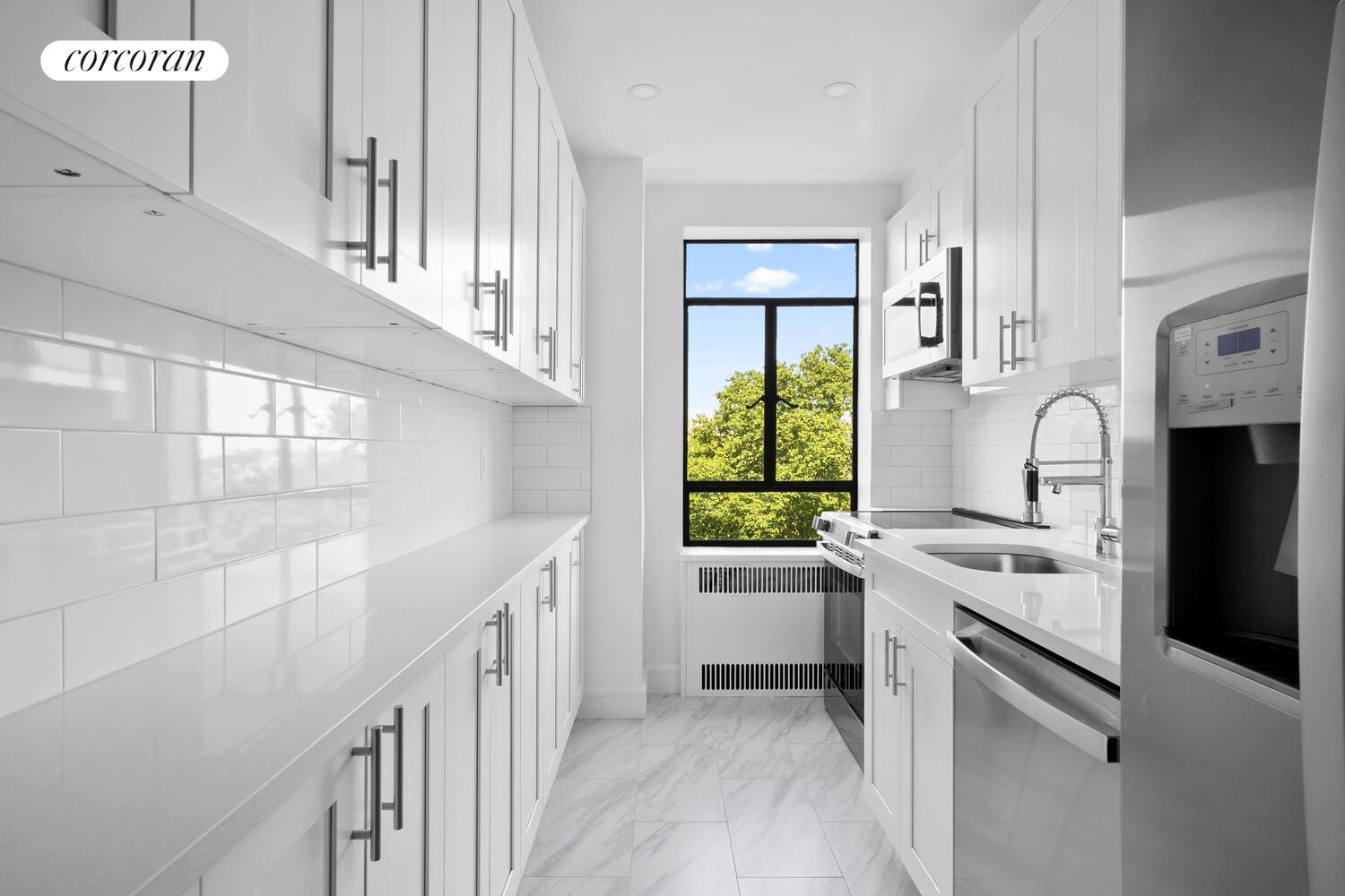 100 Riverside Drive, Unit 7B Manhattan, NY 10024 - Photo 5 of 11 a kitchen with a sink stove and refrigerator