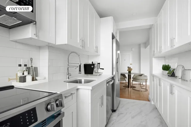 a kitchen with a sink stove and cabinets