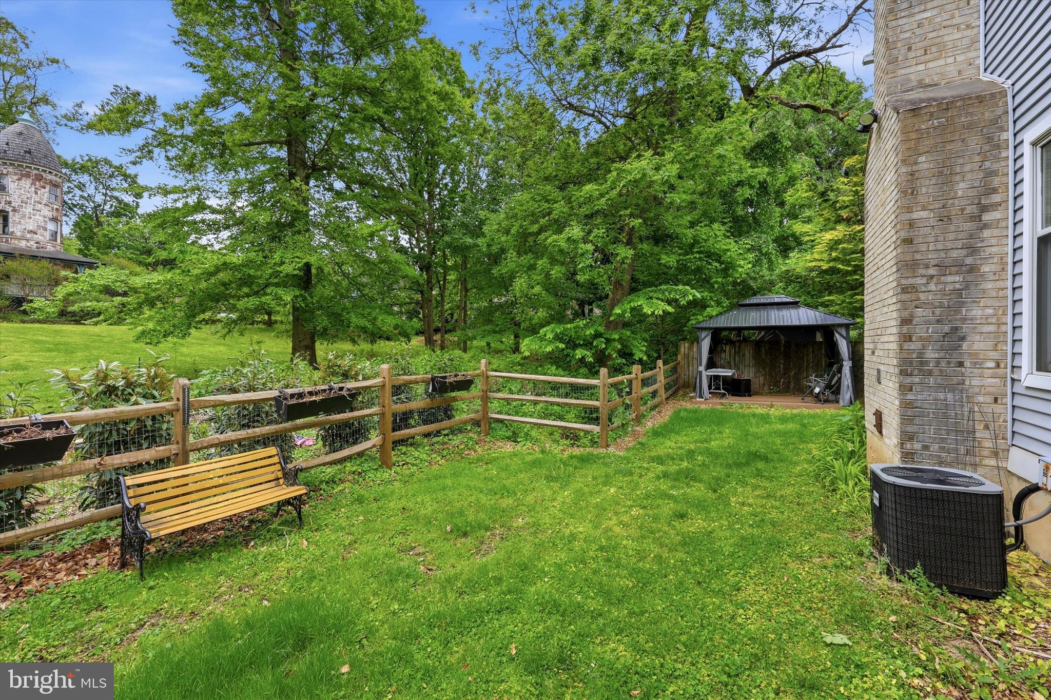320 Maple Avenue Wyncote, PA 19095 - Photo 28 of 28 a view of a backyard with wooden fence and a bench
