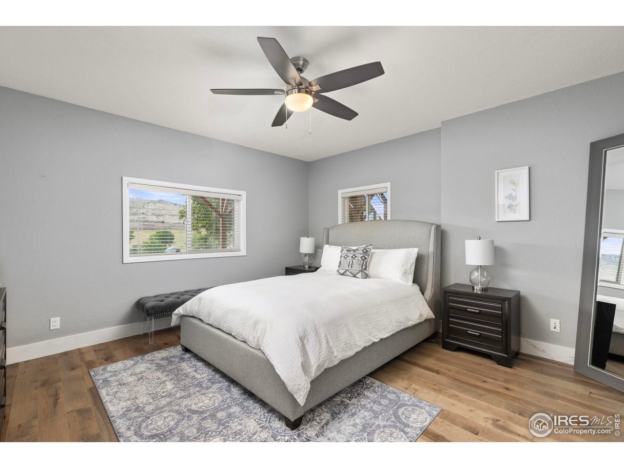 6586 Abaco Lane Berthoud, CO 80513 - Photo 18 of 40 a bedroom with a bed and a view of kitchen