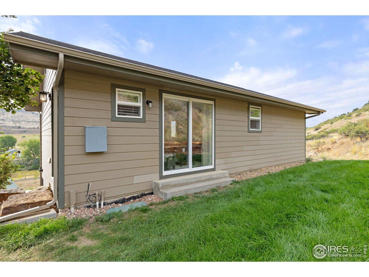 6586 Abaco Lane Berthoud, CO 80513 - Photo 23 of 40 a front view of a house with a yard