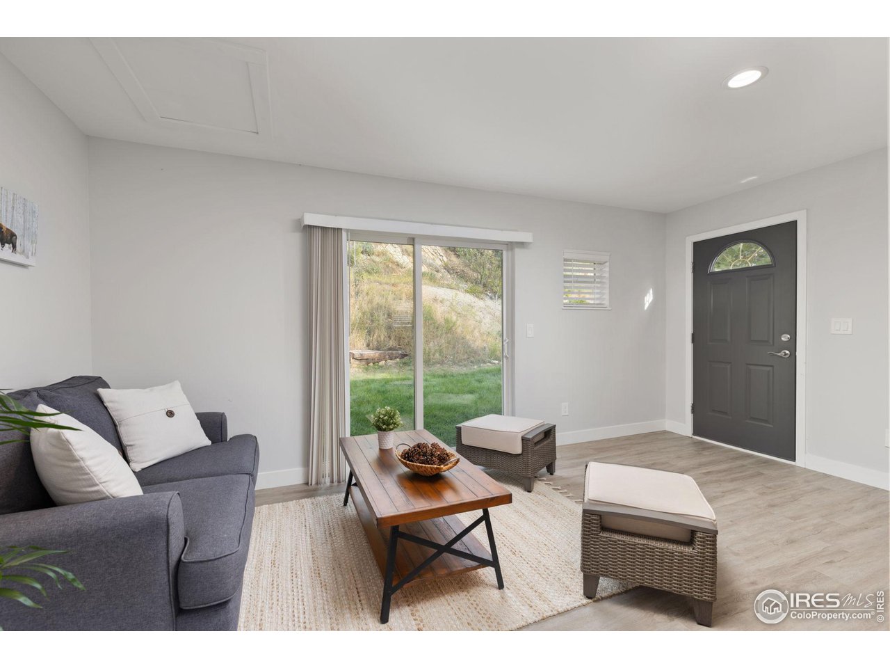 6586 Abaco Lane Berthoud, CO 80513 - Photo 24 of 40 a living room with furniture and a window