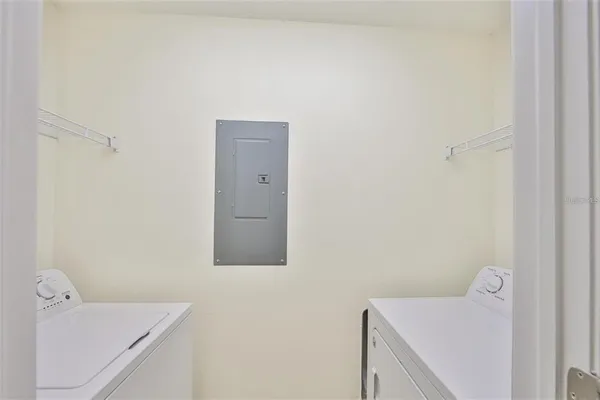 a utility room with a sink dryer and washer