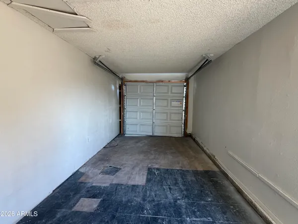 a view of a door with a white wall