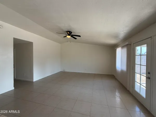 a view of an empty room with a window