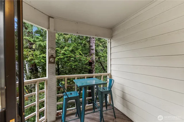 a view of a chair and table in the room