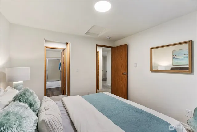 a bedroom with a bed and hallway