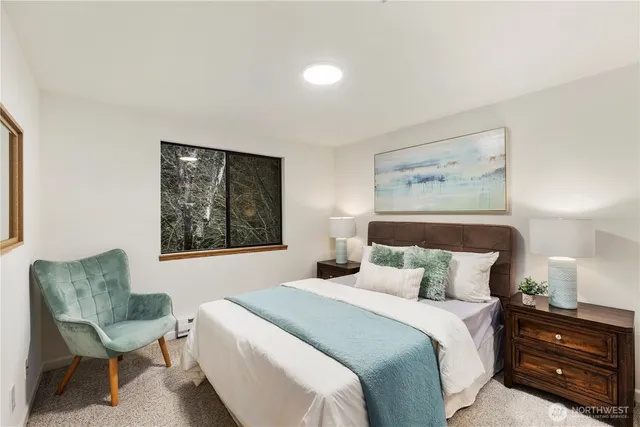 a bedroom with a bed and a chair