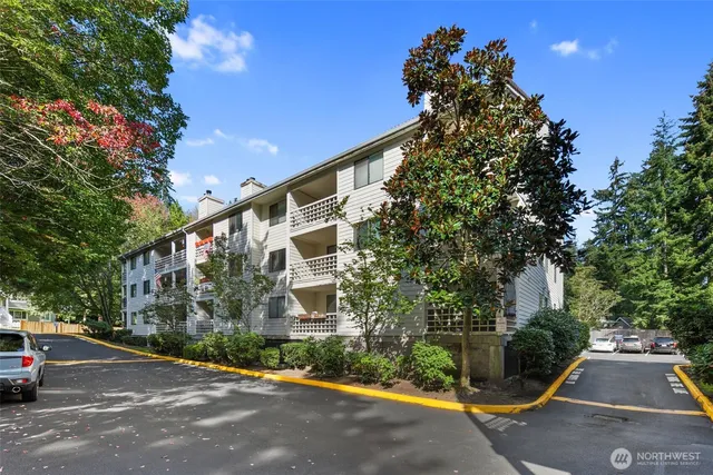 a front view of a house with a yard and a garage