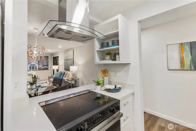 a kitchen with stainless steel appliances granite countertop a stove and a cabinets