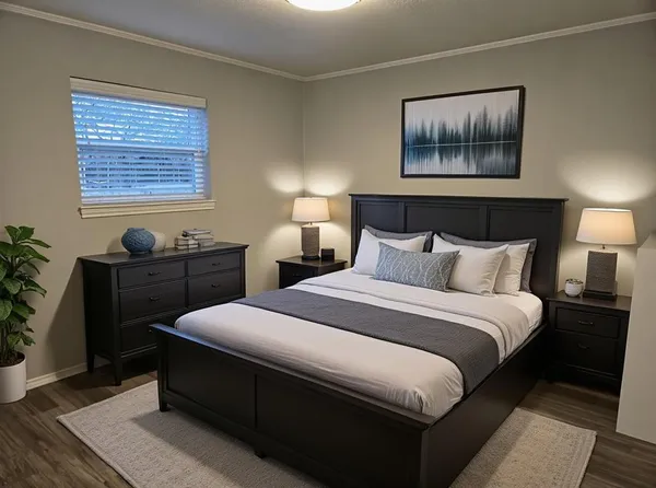 a bedroom with bed and paintings on the wall