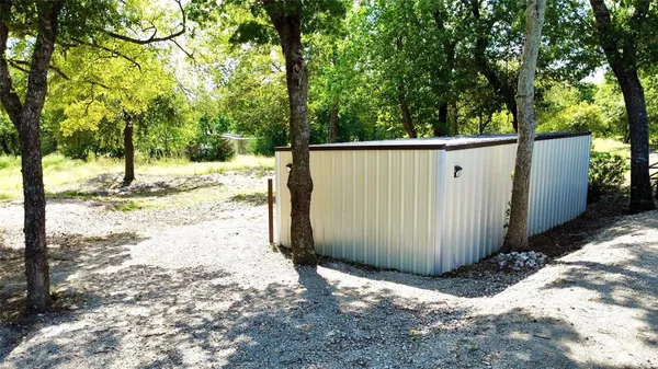 a view of a backyard of the house