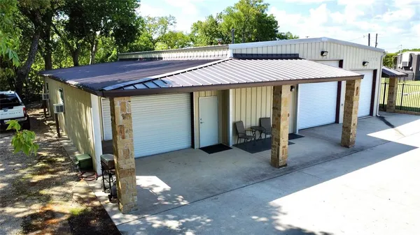 a view of a house with a porch and furniture