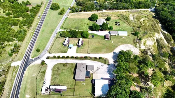 an aerial view of residential houses with outdoor space