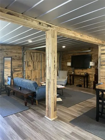 a view of a livingroom with furniture and a window
