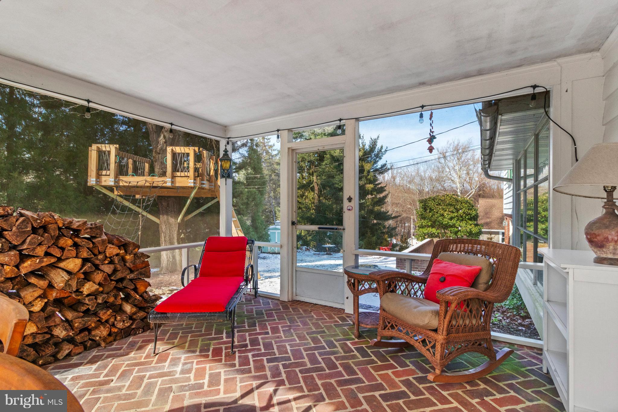 106 Orchard Road Paoli, PA 19301 - Photo 14 of 29 Lovely screened porch with brick floor.