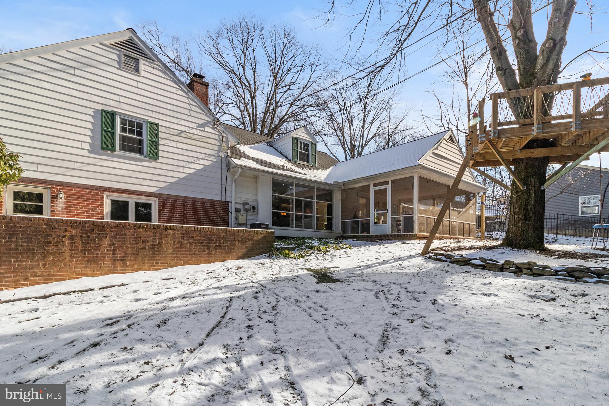 106 Orchard Road Paoli, PA 19301 - Photo 29 of 29 Rear yard with treehouse, firepit and play area.