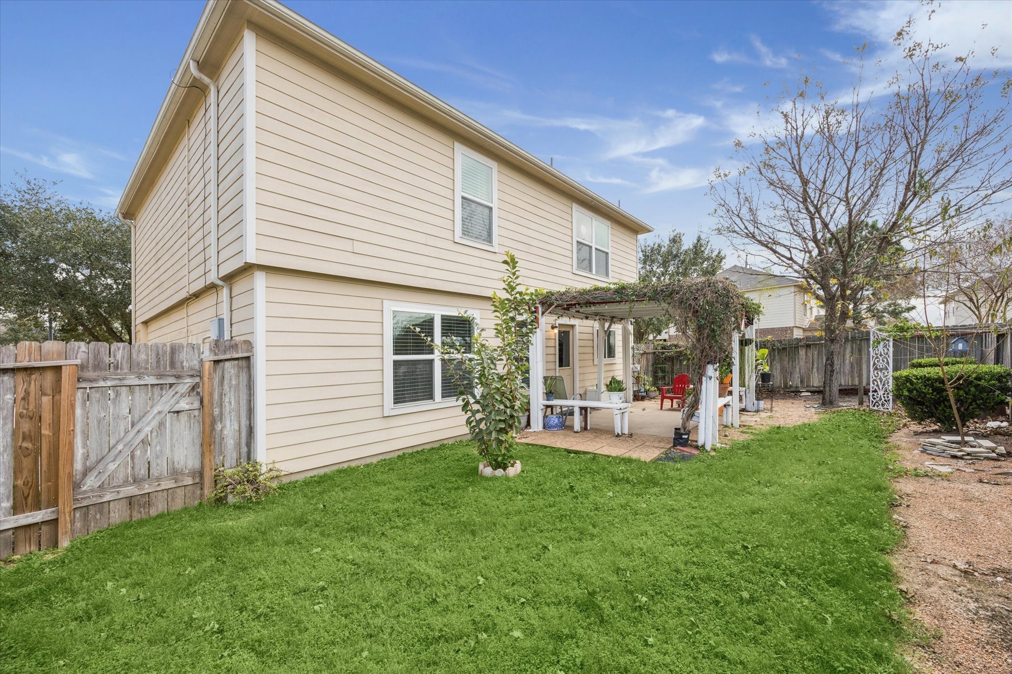 5003 Juniper Spring Trail Katy, TX 77449 - Photo 13 of 13 a front view of a house with garden and sitting area