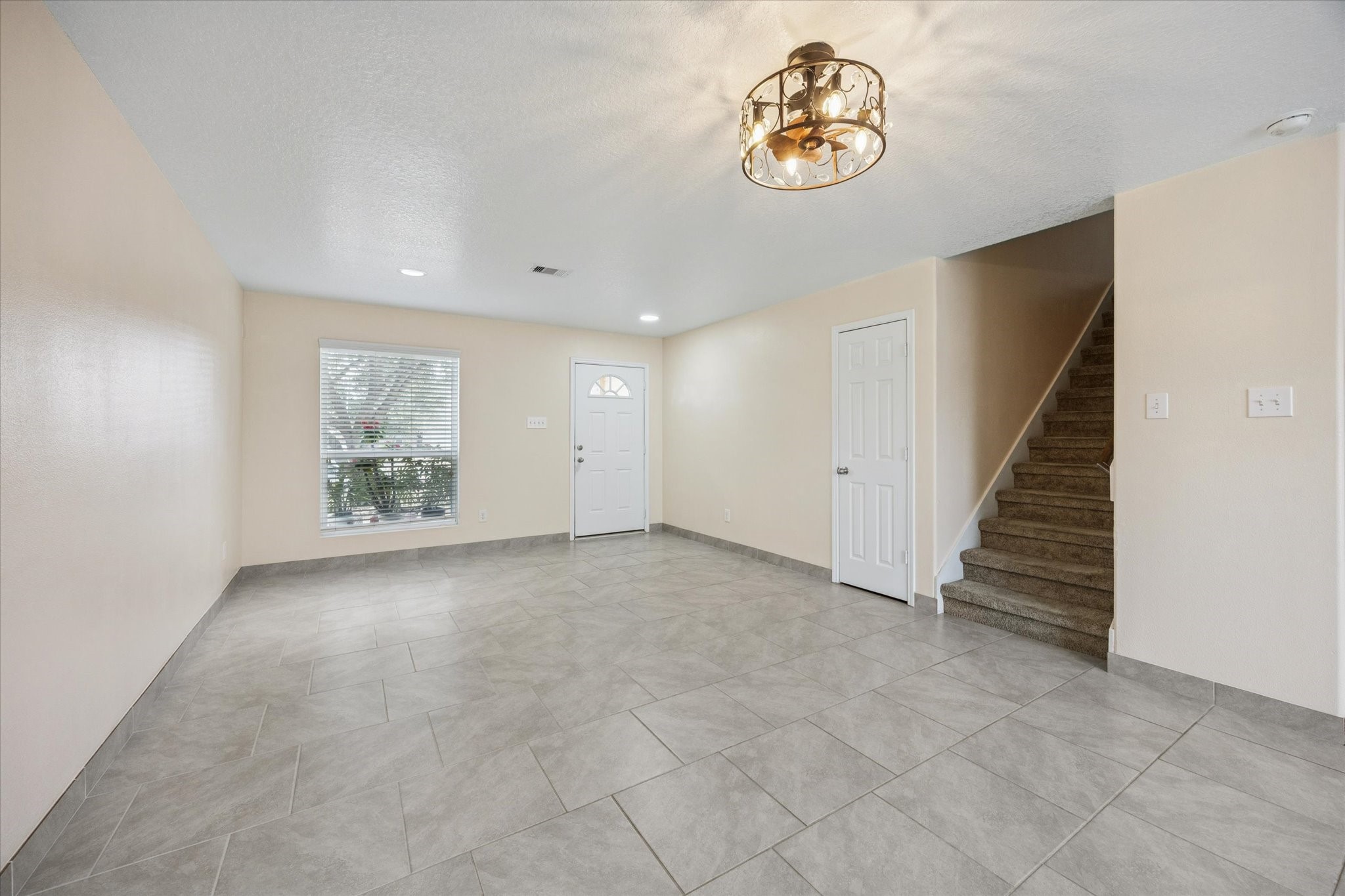 5003 Juniper Spring Trail Katy, TX 77449 - Photo 5 of 13 wooden floor in an empty room with a window