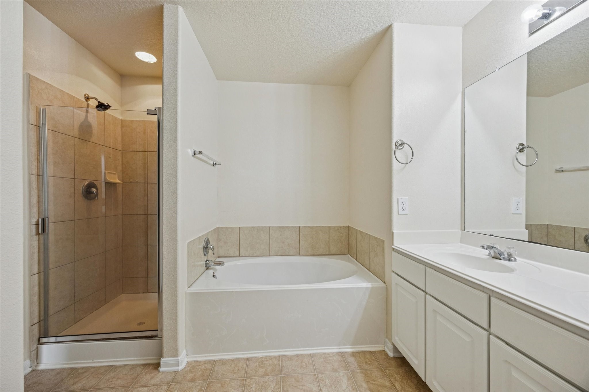 5003 Juniper Spring Trail Katy, TX 77449 - Photo 7 of 13 a white bath tub sitting next to a bathroom