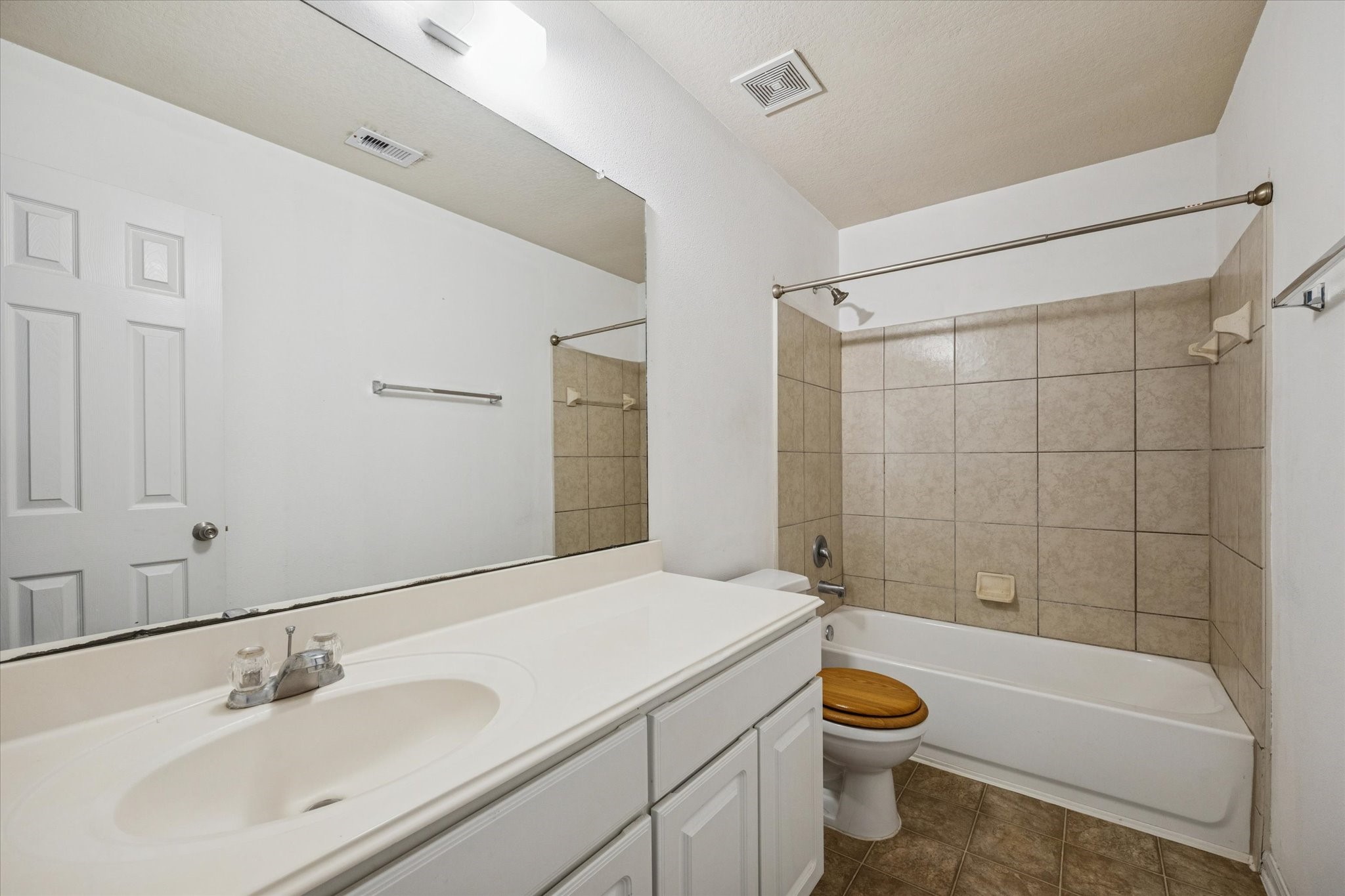 5003 Juniper Spring Trail Katy, TX 77449 - Photo 10 of 13 a bathroom with a sink a toilet and shower