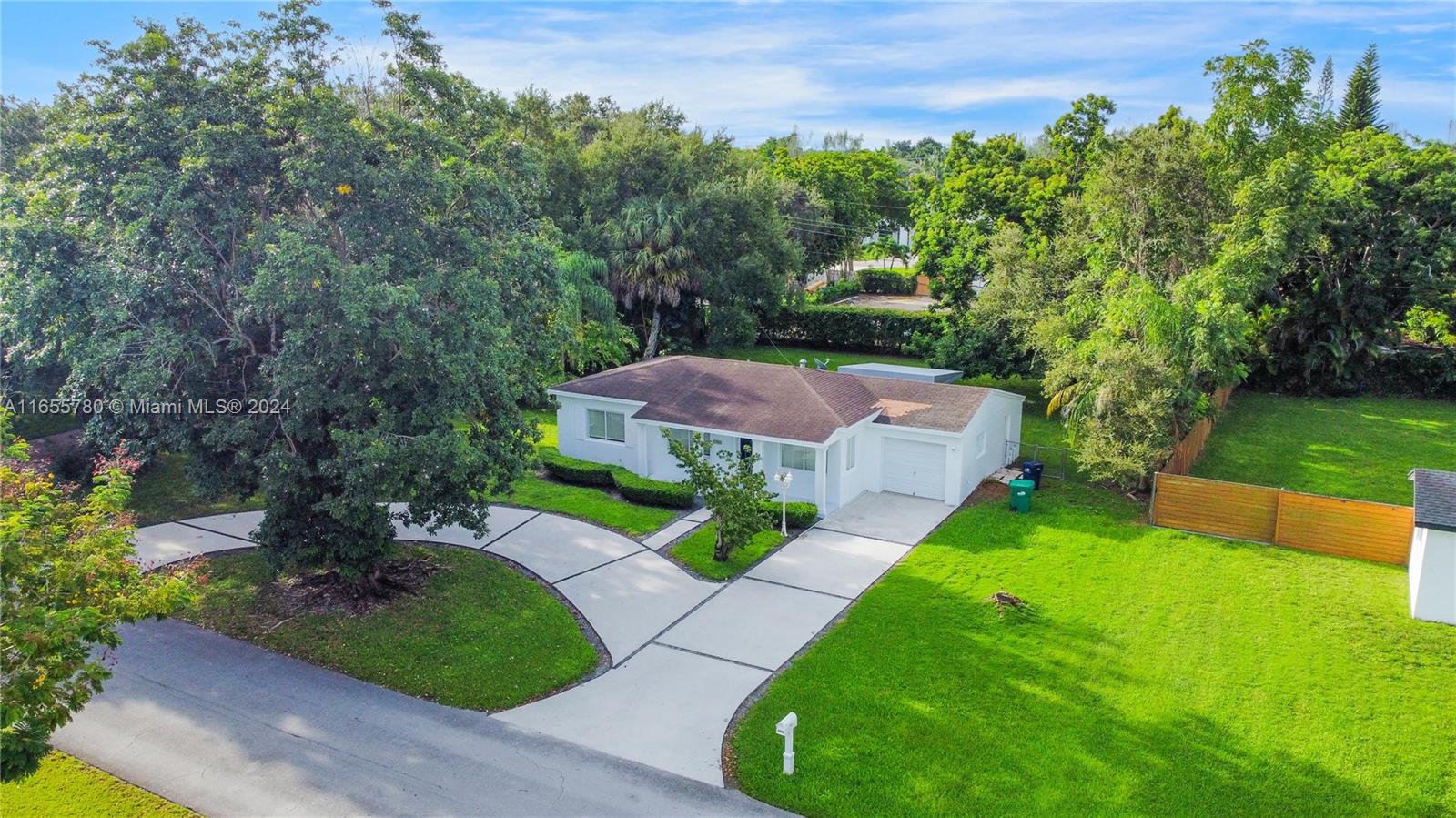 6990 Southwest 58th Street Miami, FL 33143 - Photo 1 of 11 a view of a house with a yard