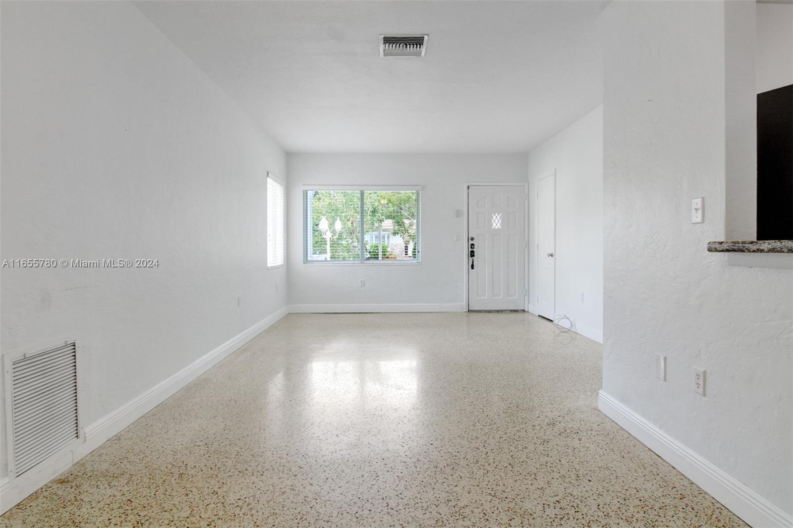 6990 Southwest 58th Street Miami, FL 33143 - Photo 5 of 11 an empty room with windows