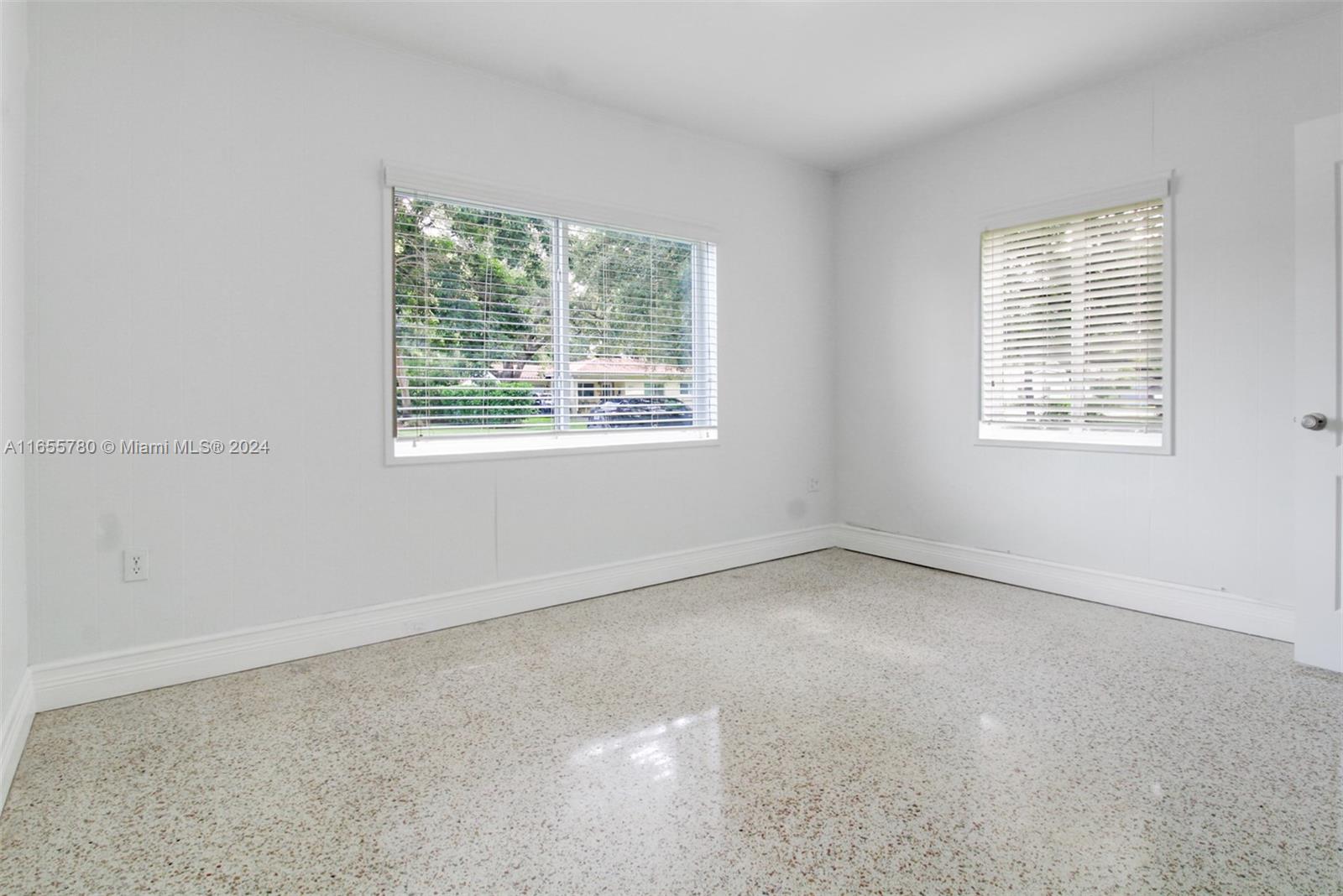 6990 Southwest 58th Street Miami, FL 33143 - Photo 10 of 11 an empty room with a window