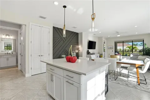 a view of a kitchen and kitchen island