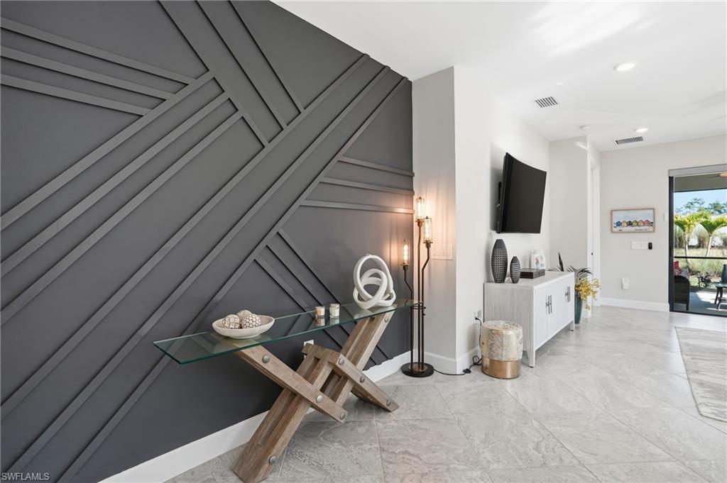 17377 Corsini Drive Fort Myers, FL 33913 - Photo 13 of 49 a view of a livingroom with furniture and a flat screen tv