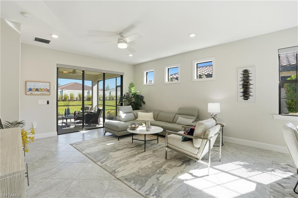 17377 Corsini Drive Fort Myers, FL 33913 - Photo 16 of 49 a living room with furniture and a large window