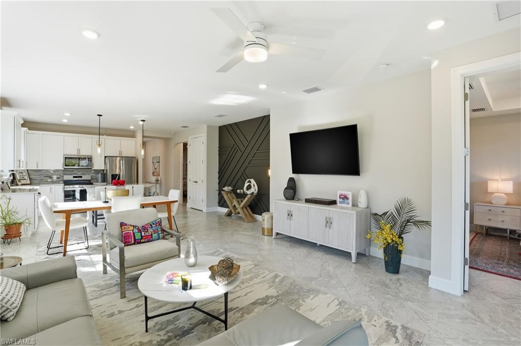 17377 Corsini Drive Fort Myers, FL 33913 - Photo 18 of 49 a living room with furniture and a flat screen tv