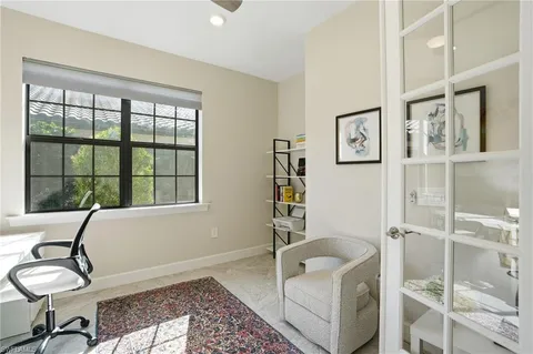a bathroom with a tub and view of bathroom