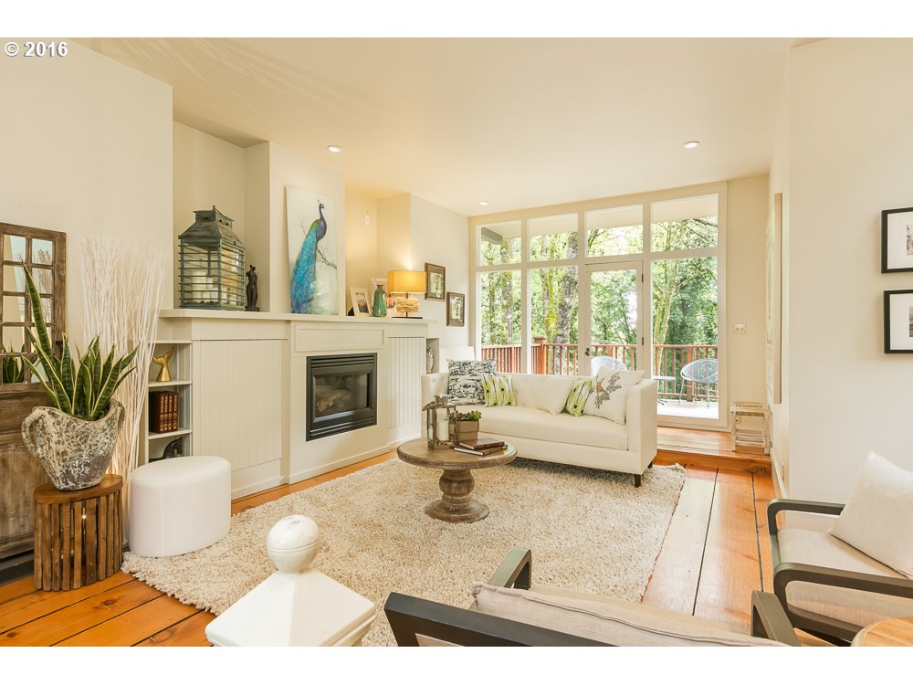2762 Southwest Talbot Road Portland, OR 97201 - Photo 3 of 16 a living room with furniture and a fireplace