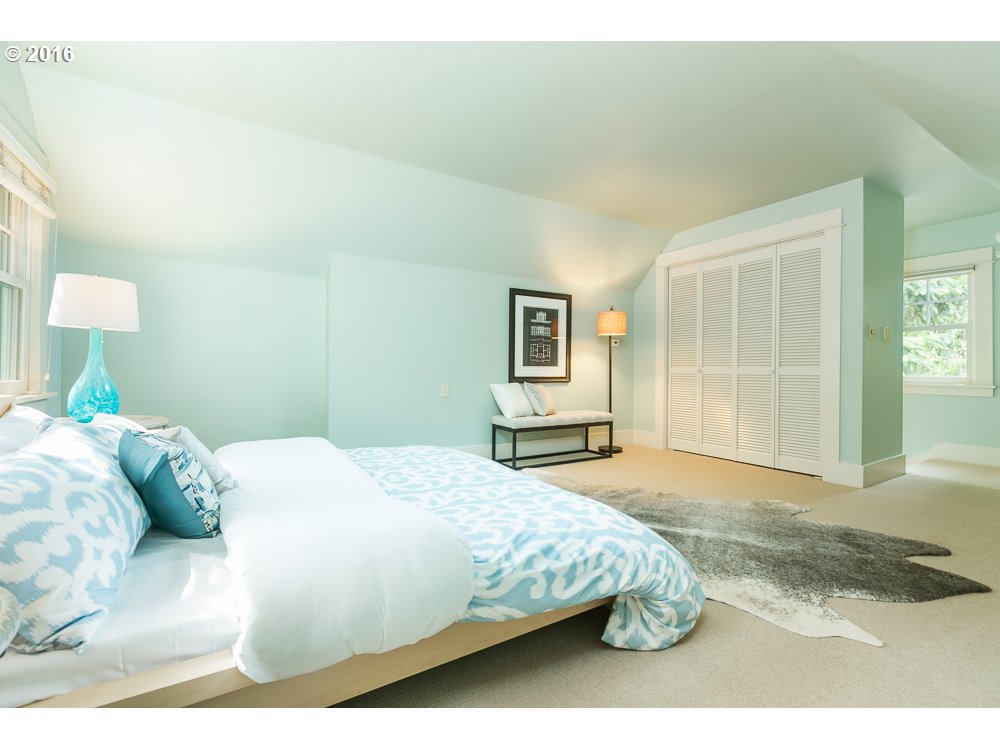 2762 Southwest Talbot Road Portland, OR 97201 - Photo 8 of 16 a bedroom with a bed and a painting