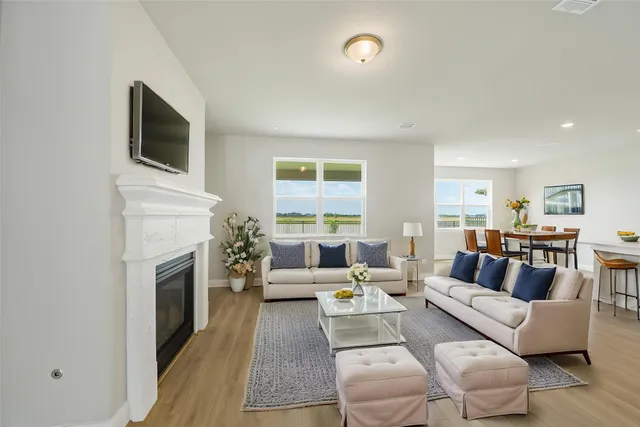 a living room with furniture fireplace and flat screen tv