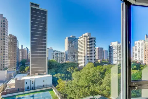 a bathroom with a sink vanity mirror and toilet