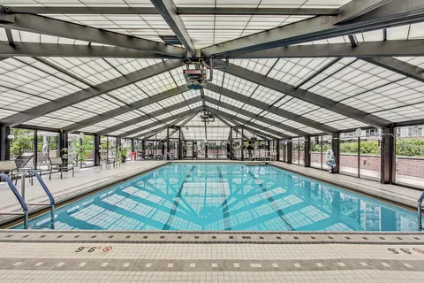 a view of patio with dining table and chairs